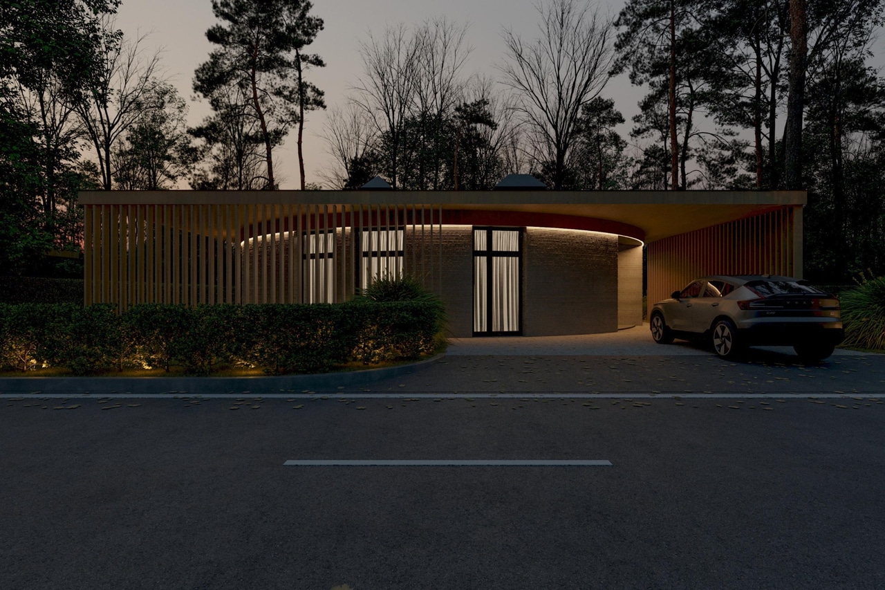 SVOI house with a curved facade, timber slats and warm evening lighting.
